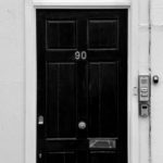 black wooden door with silver handle