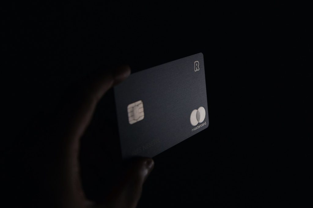 Person holding black card