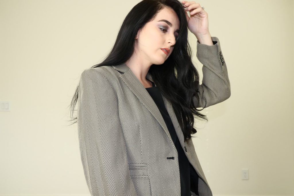 Woman in gray suit jacket