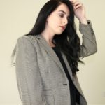 Woman in gray suit jacket